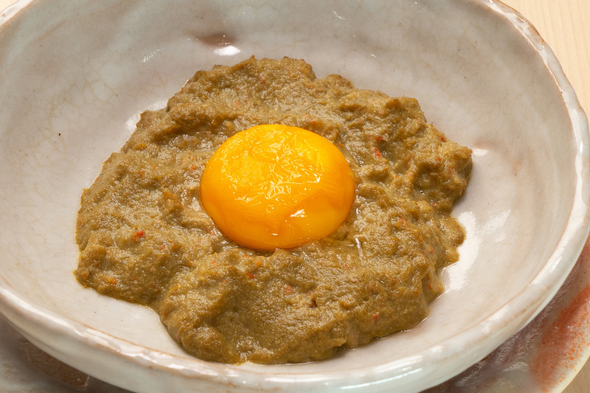 「カニミソ卵黄焼き」