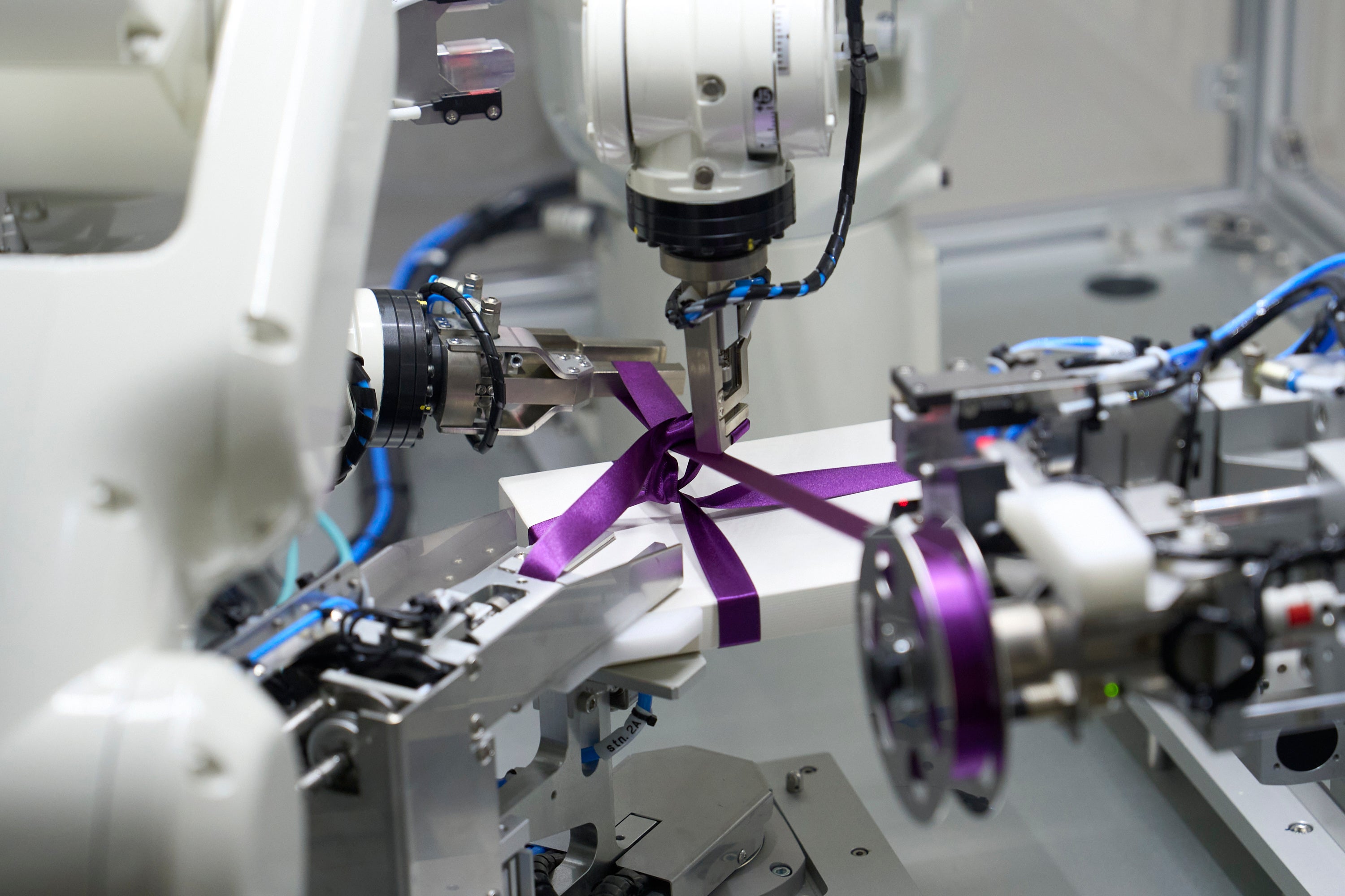 Examples of equipment developed by Abilica  Automatic ribbon-tie tying machine for gift boxes