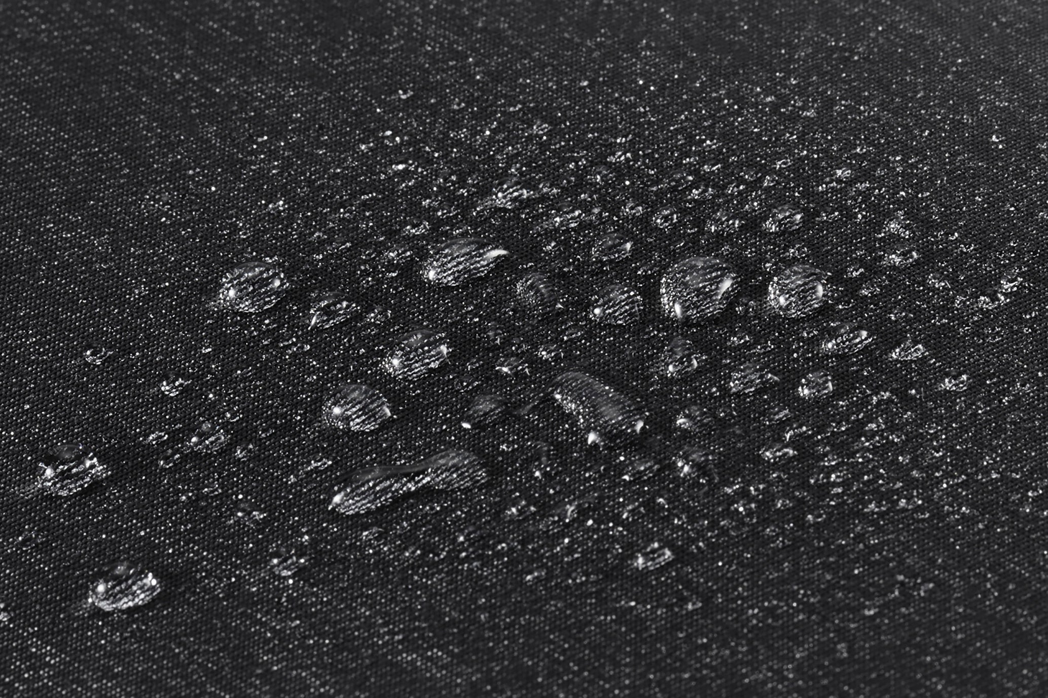 杢調生地表面に撥水加工、裏面にPVC加工