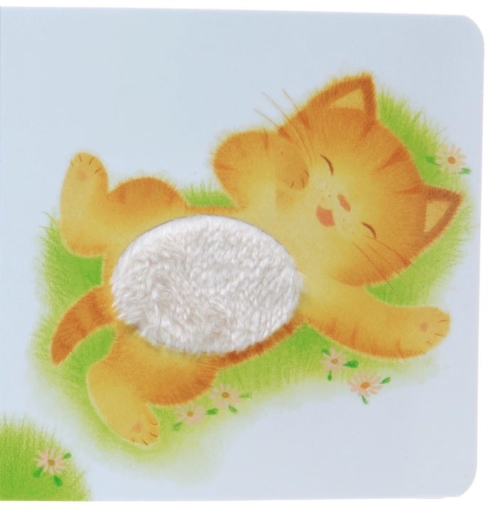 ▲『ふわふわ だあれ？』本文ページ。ねこさんのおなかにふわふわ素材が貼り込んであります。