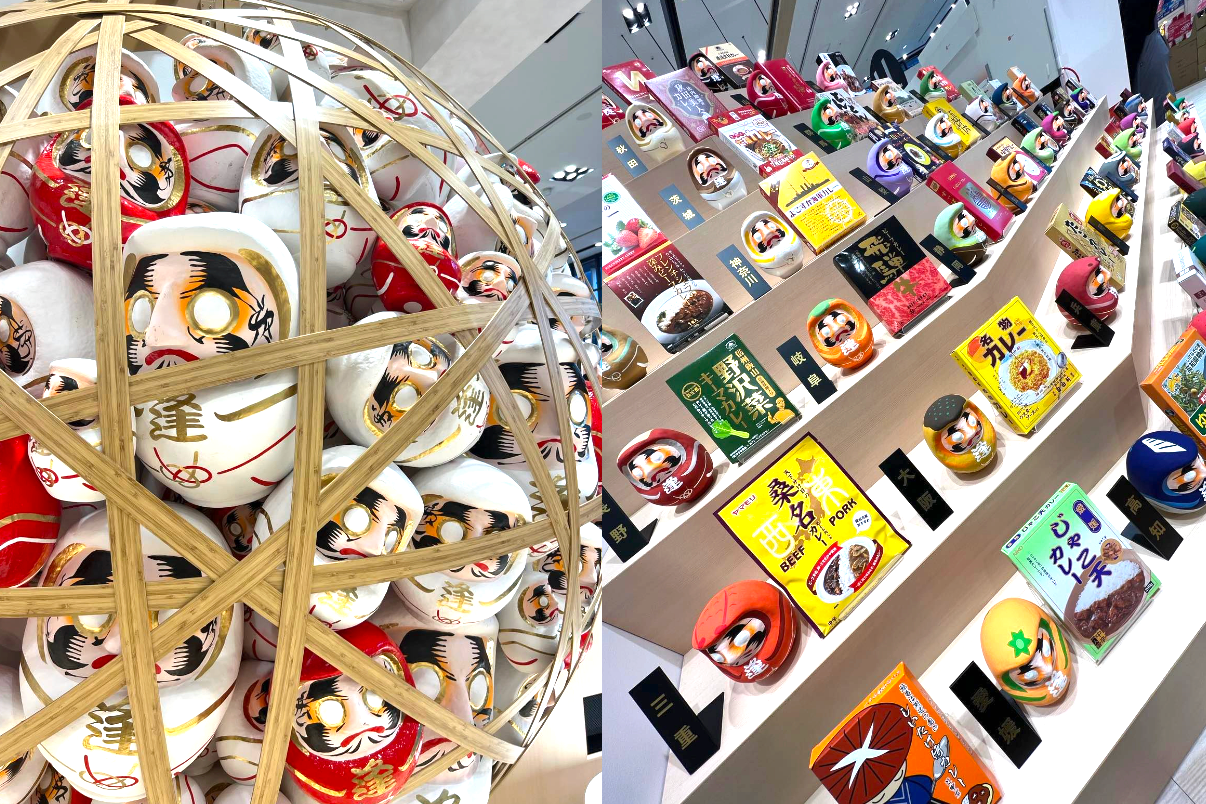 店舗内に設置されたご縁だるまガチャを利用すると各47都道府県の名産品がデザインされた「だるま」さんとテーマに沿った商品と出逢える。初回のテーマは「ご当地カレー」