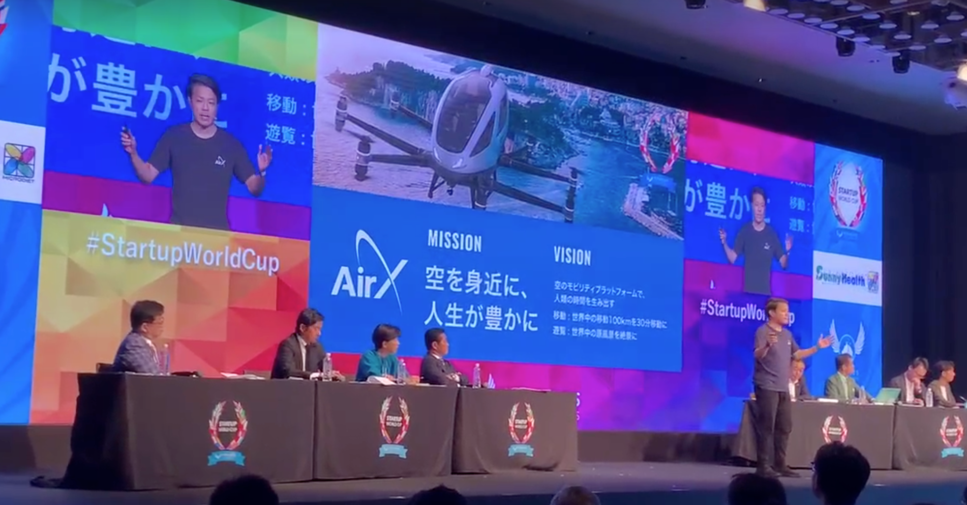 代表手塚登壇の様子