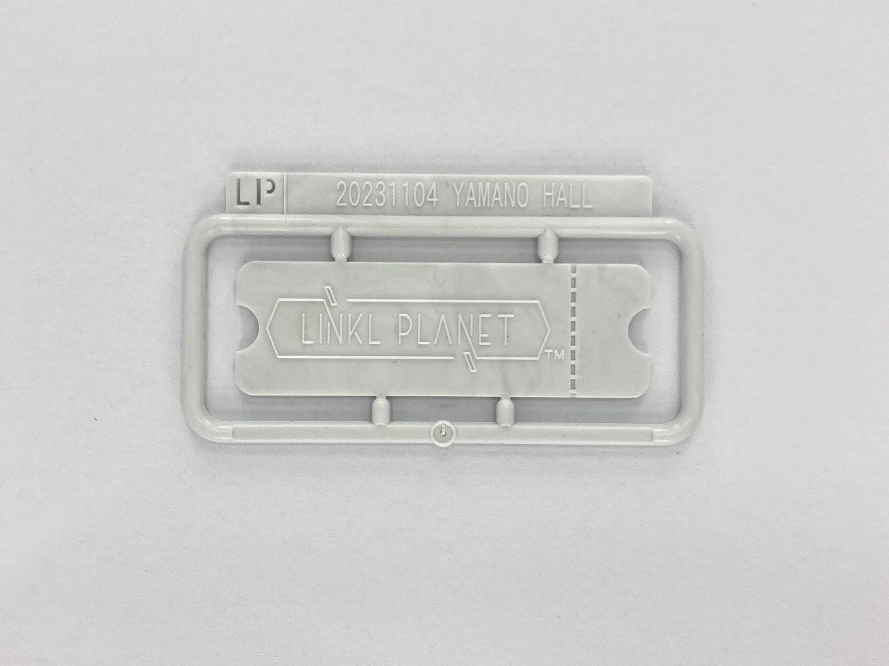 当日配布する「リンプラマークミニプラ」の試作品（当日はボールチェーンと一緒に配布する予定）