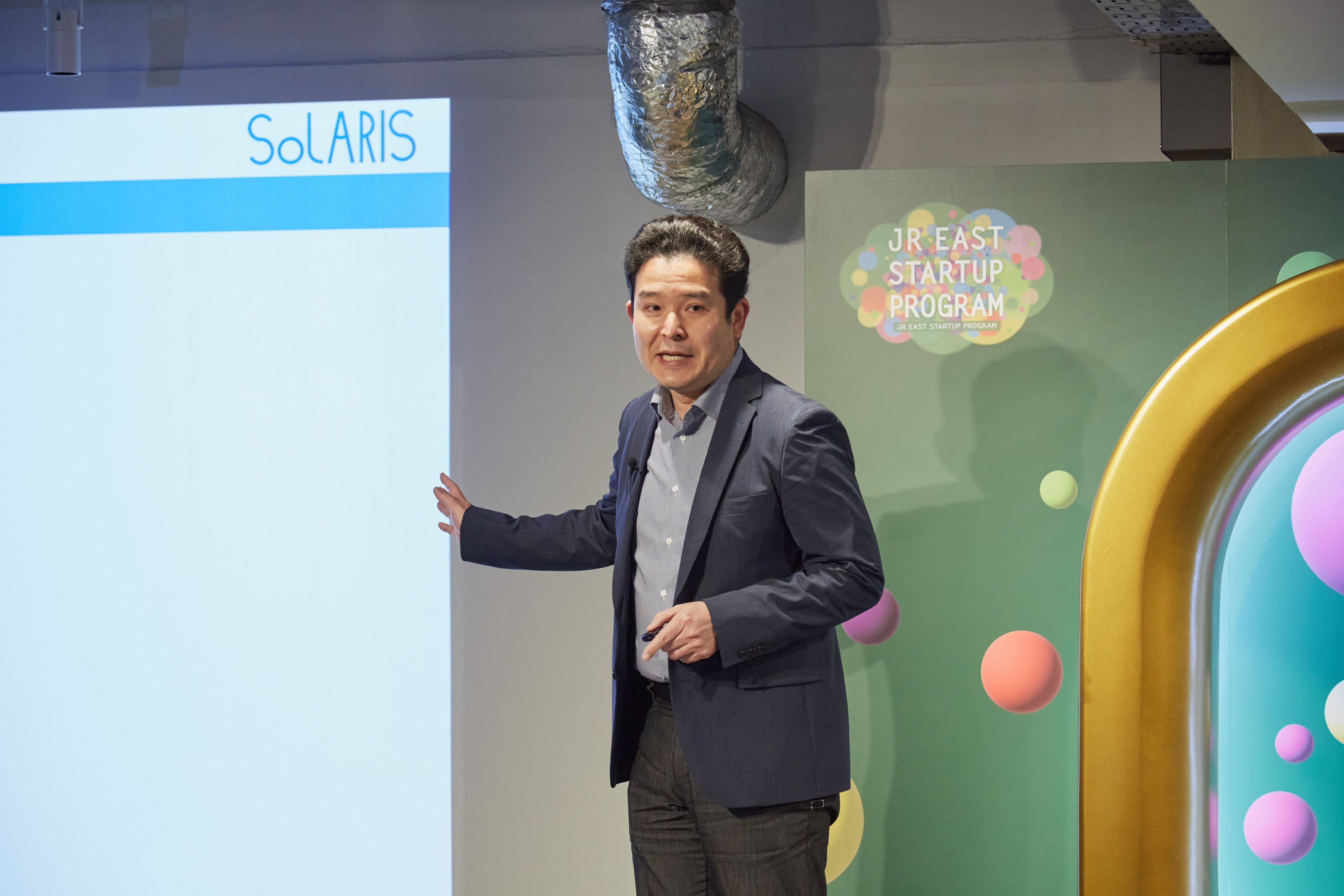 ▲プレゼンテーションするソラリスの梅田代表取締役