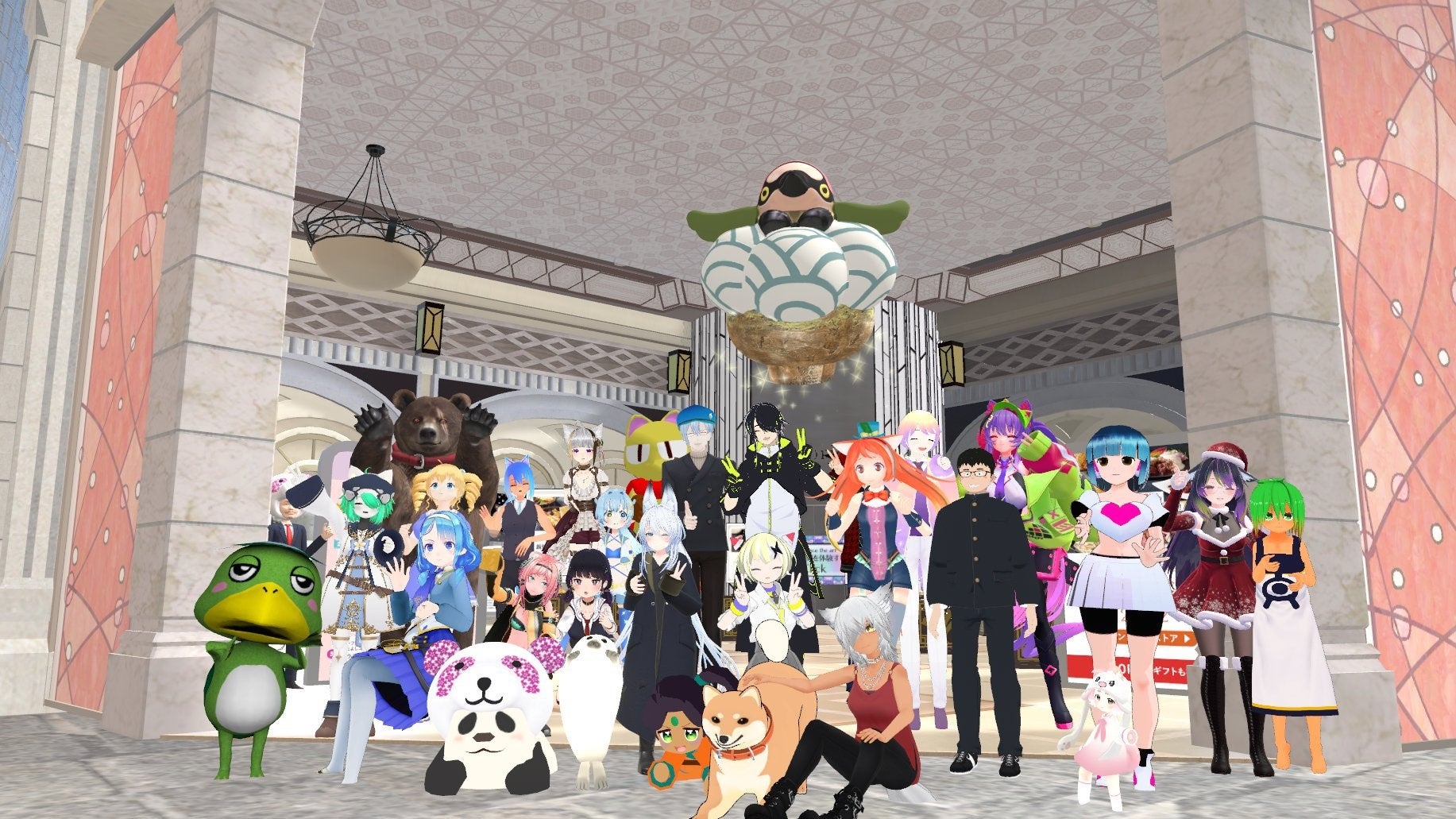 大丸松坂屋ブースの前で集合写真を撮影するアンバサダーと来場者