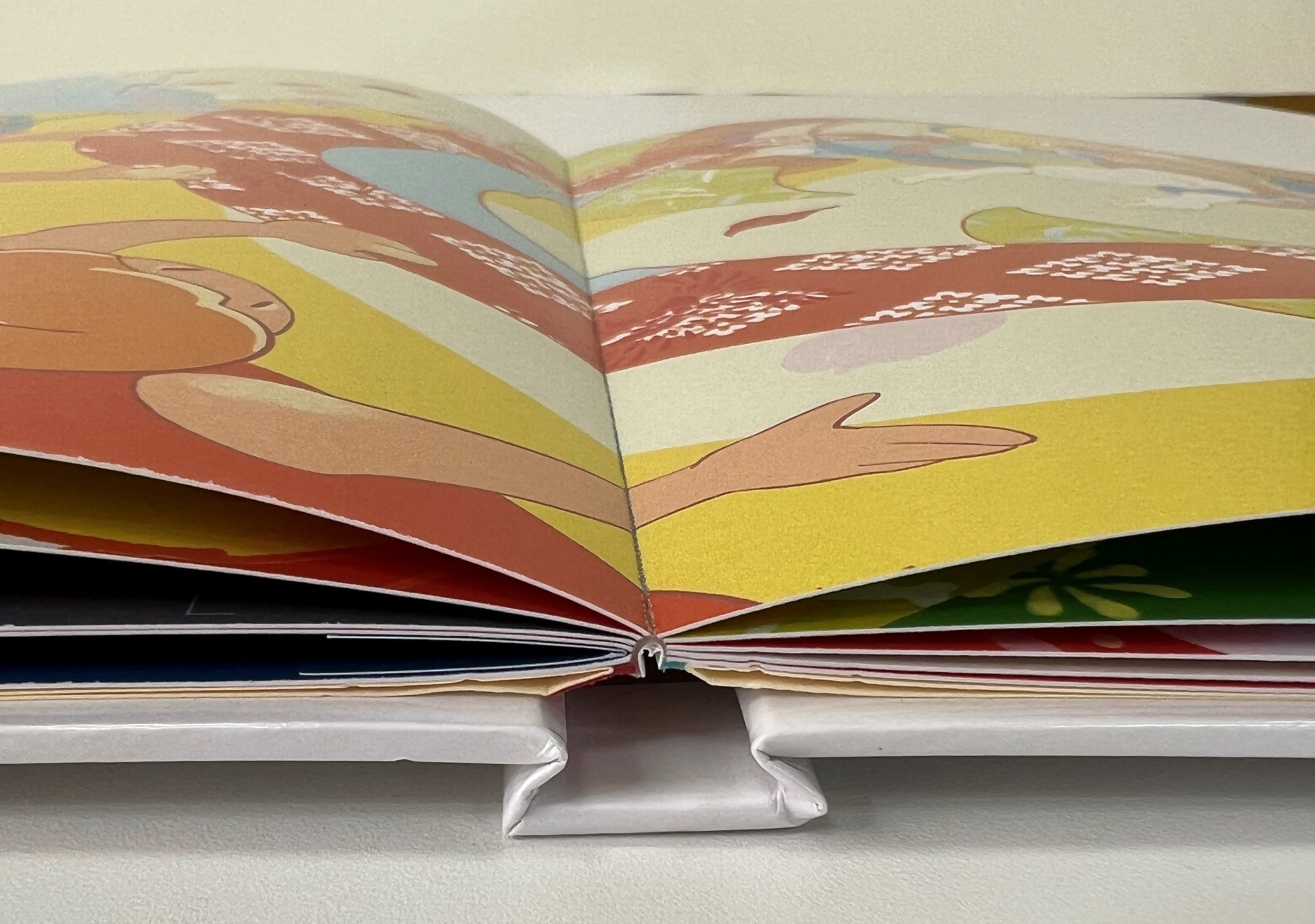 “ノド元”まで開いても壊れにくい「PUR製本」を採用