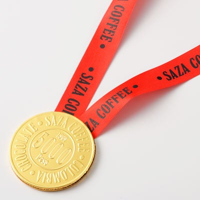 コインチョコレート（金メダルチョコ）　250円(税込)コロンビア産のカカオを使用し、食べやすいミルクチョコレートを使用。