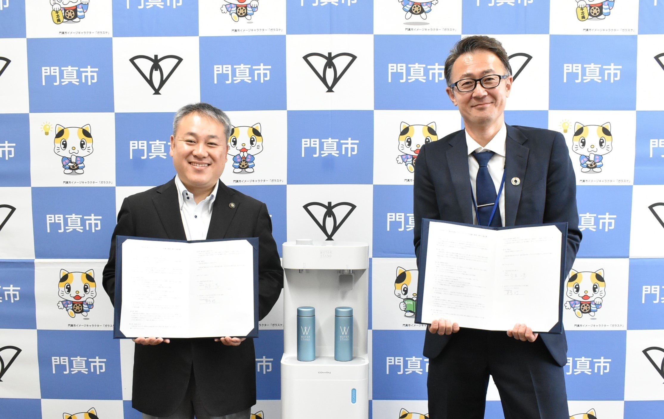 （写真左：門真市長　宮本 一孝様）
