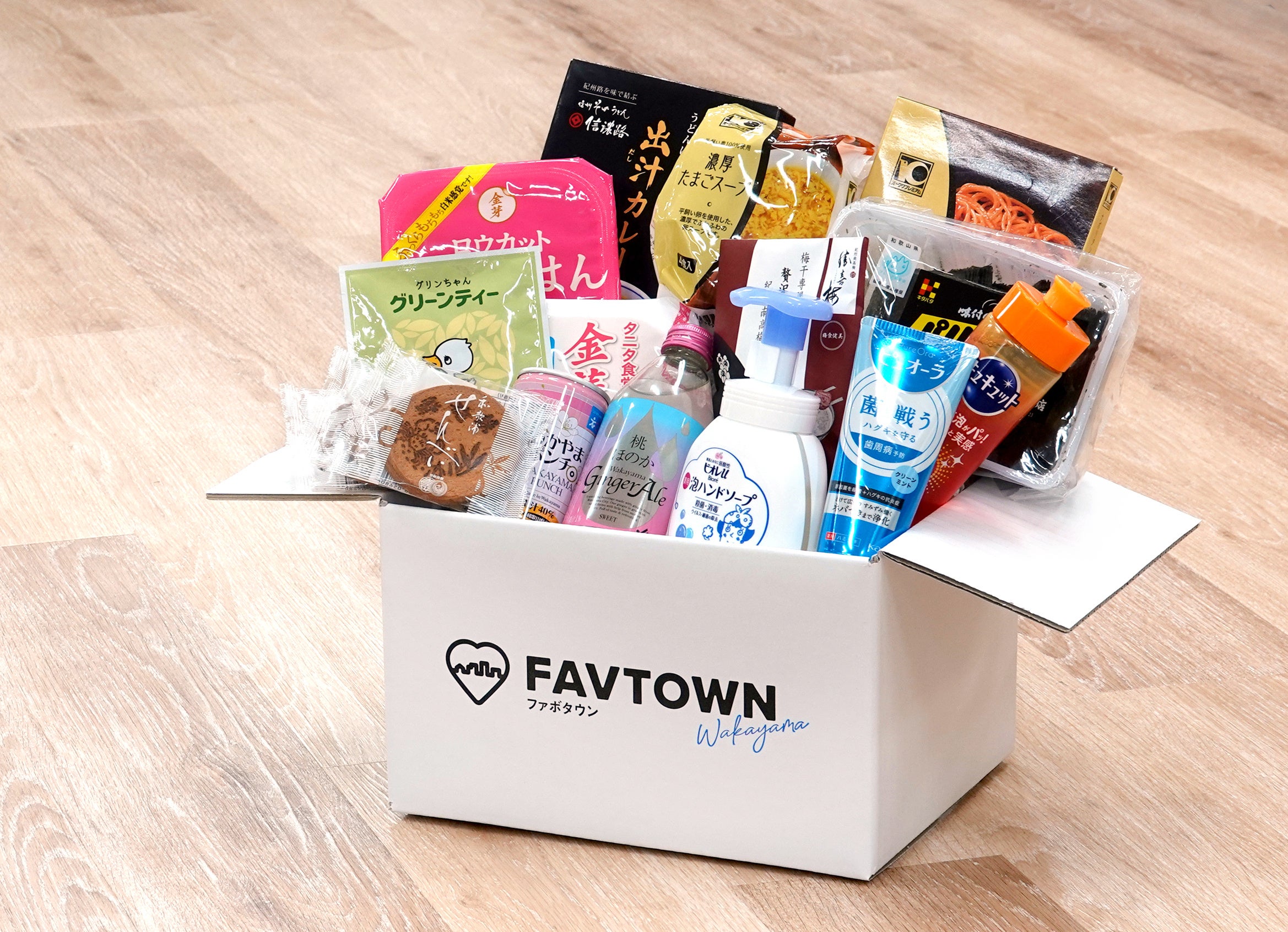 地元協賛企業の製品を詰め合わせた「ふるさと便」　実証事業での協賛：株式会社オークワ、花王株式会社和歌山工場、株式会社北畑海苔店、株式会社玉林園、株式会社信濃路、株式会社勝僖梅、株式会社 総本家駿河屋、東洋ライス株式会社　※敬称略・50音順