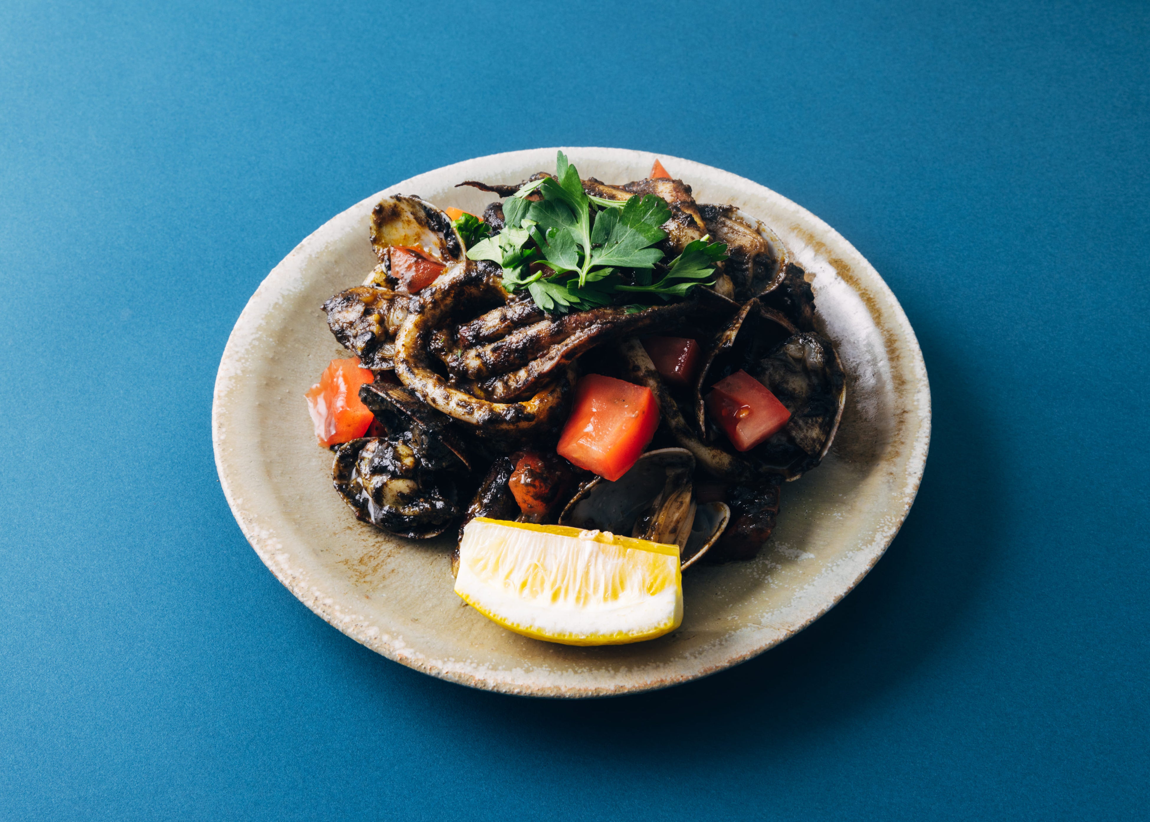 「スルメイカ 肝バター焼き シチリア風」