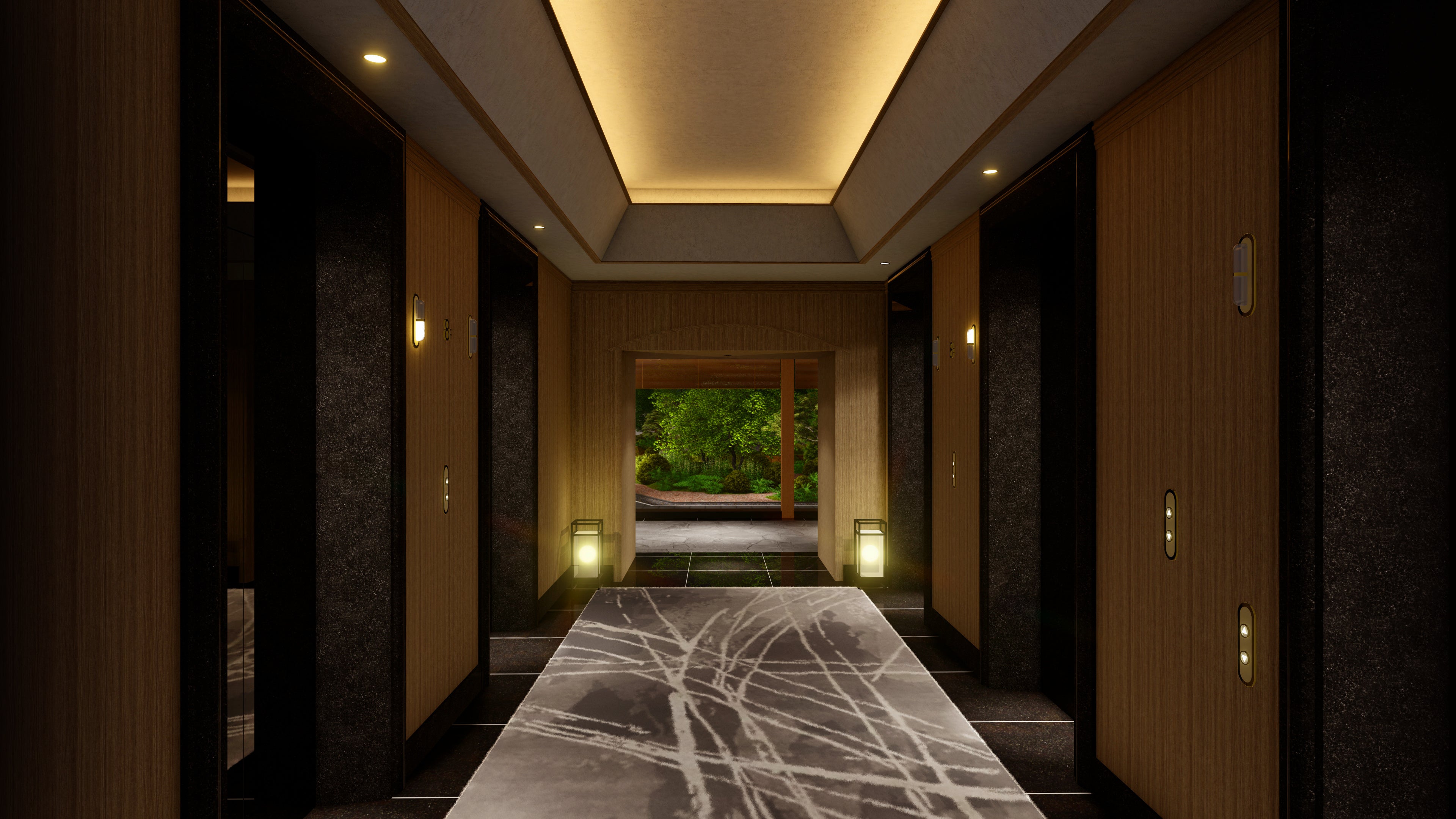 エレベーターホールより臨むライトアップされた夜の庭園　