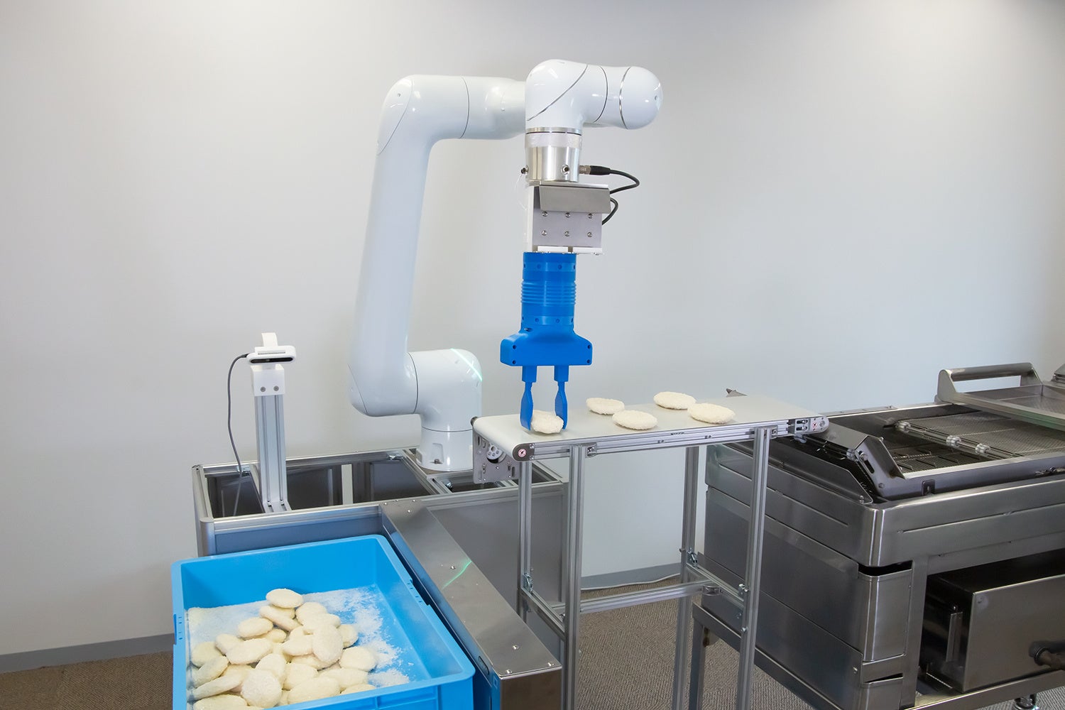 冷凍フライ投入システム　※開発中の画像です