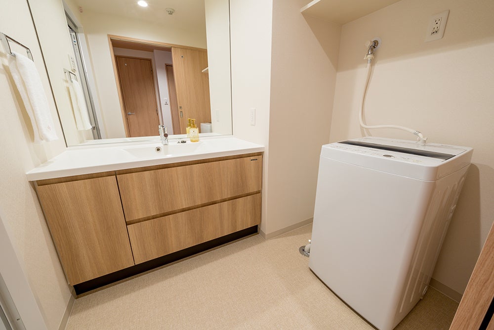 洗濯機がある、広々した洗面スペース