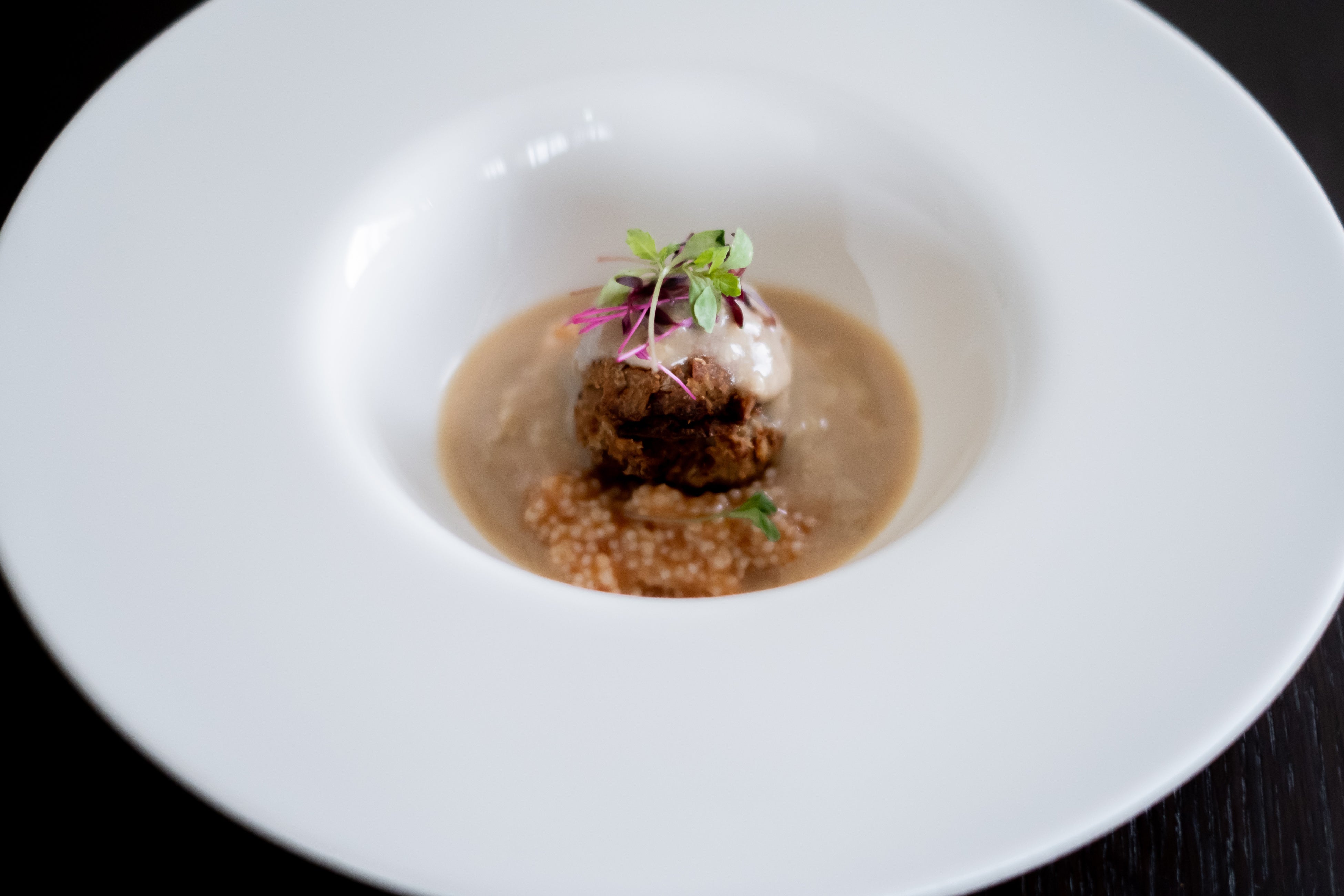 ヒエとアワのリゾット　ヴィーガンミートボール　トマトポルチーニクリームソース