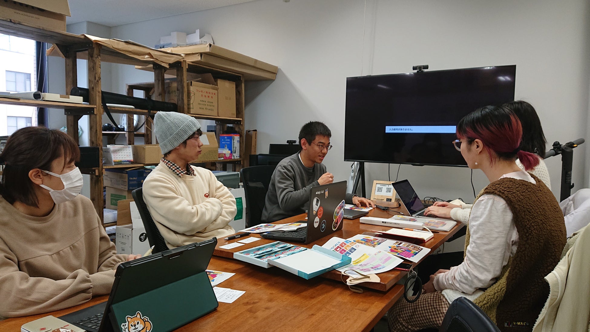 岡山大学DS部の取り組みを紹介する礒野さん(中央)