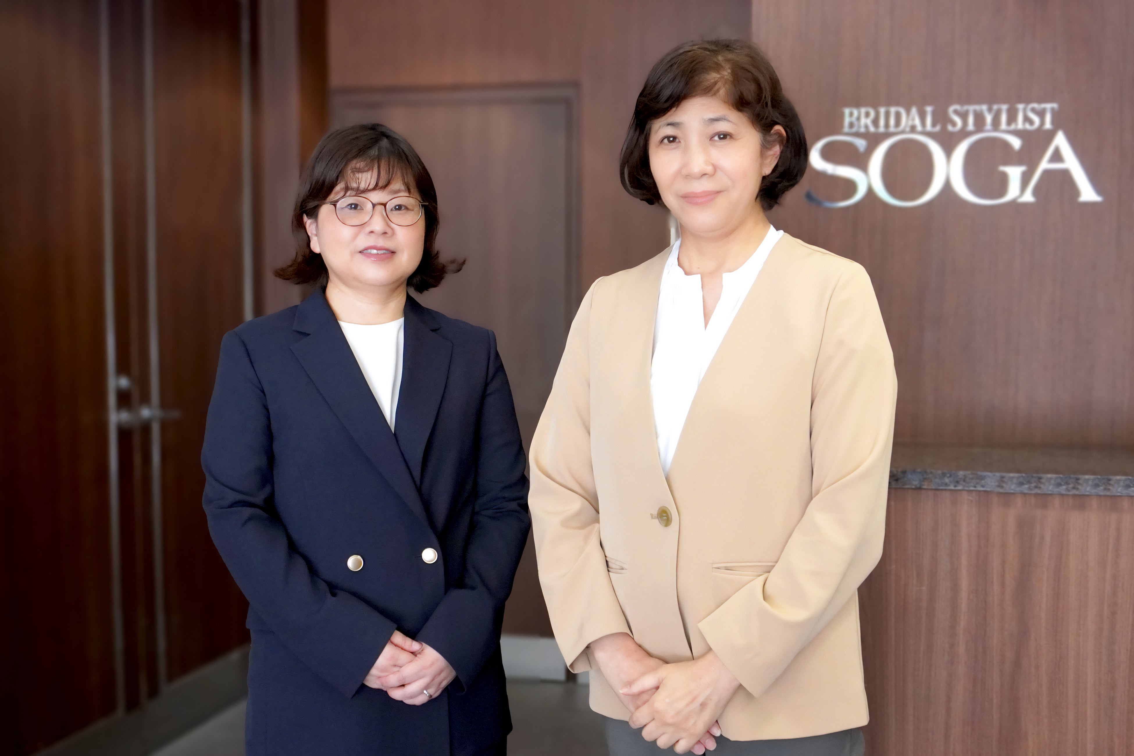 左より古井執行役員、新関百貨店営業部部長