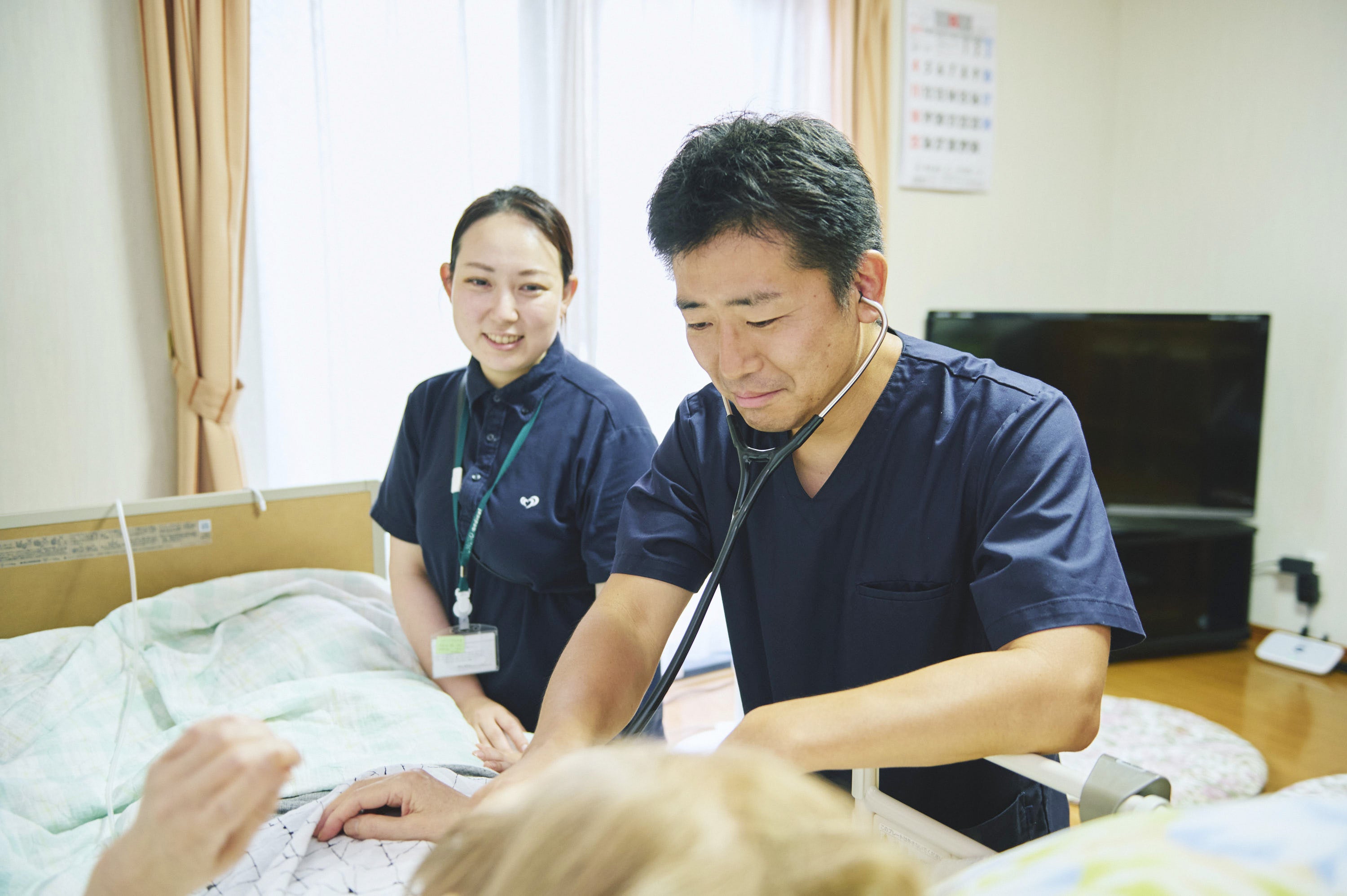 小出院長による訪問診療の様子