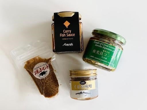 参加者に送付された、くさや味噌（東京都・八丈島）、焼ふぐの子（新潟県・佐渡島）、夜光貝のコンフィ（鹿児島県・奄美大島）、沖縄産まぐろ入りディップソース（沖縄県・伊平屋島） のセット