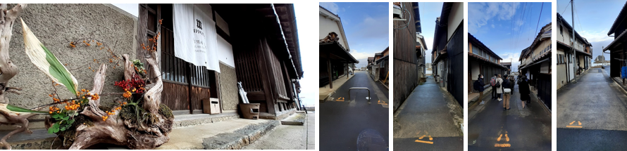 鷺浦の町並みと町の先に見える”湾内灯台”