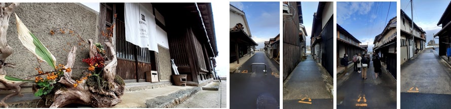 鷺浦の町並みと町の先に見える”湾内灯台”
