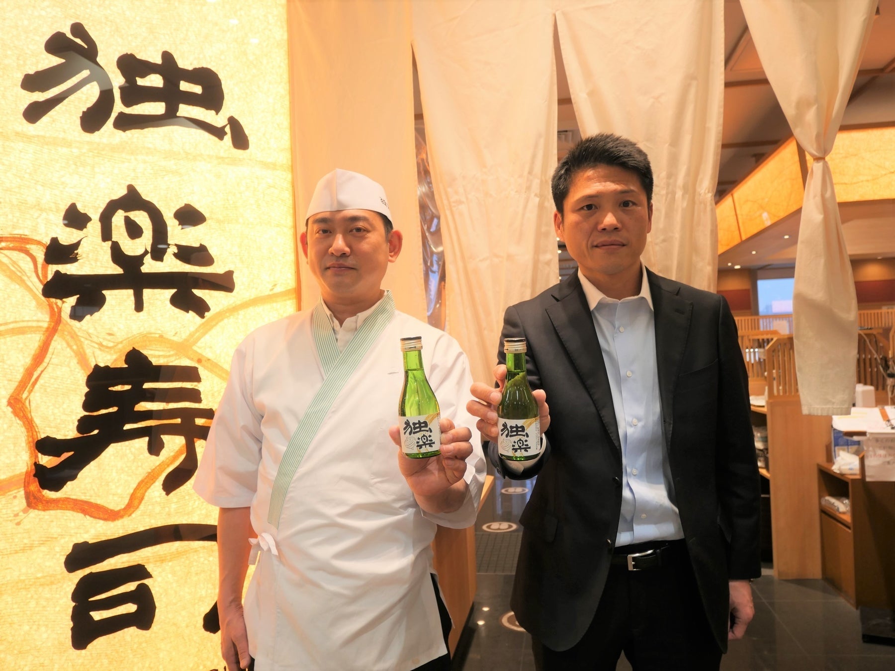 株式会社システム企画の副社長である高麗正之介氏（写真左）と株式会社 舞姫の西仲社長