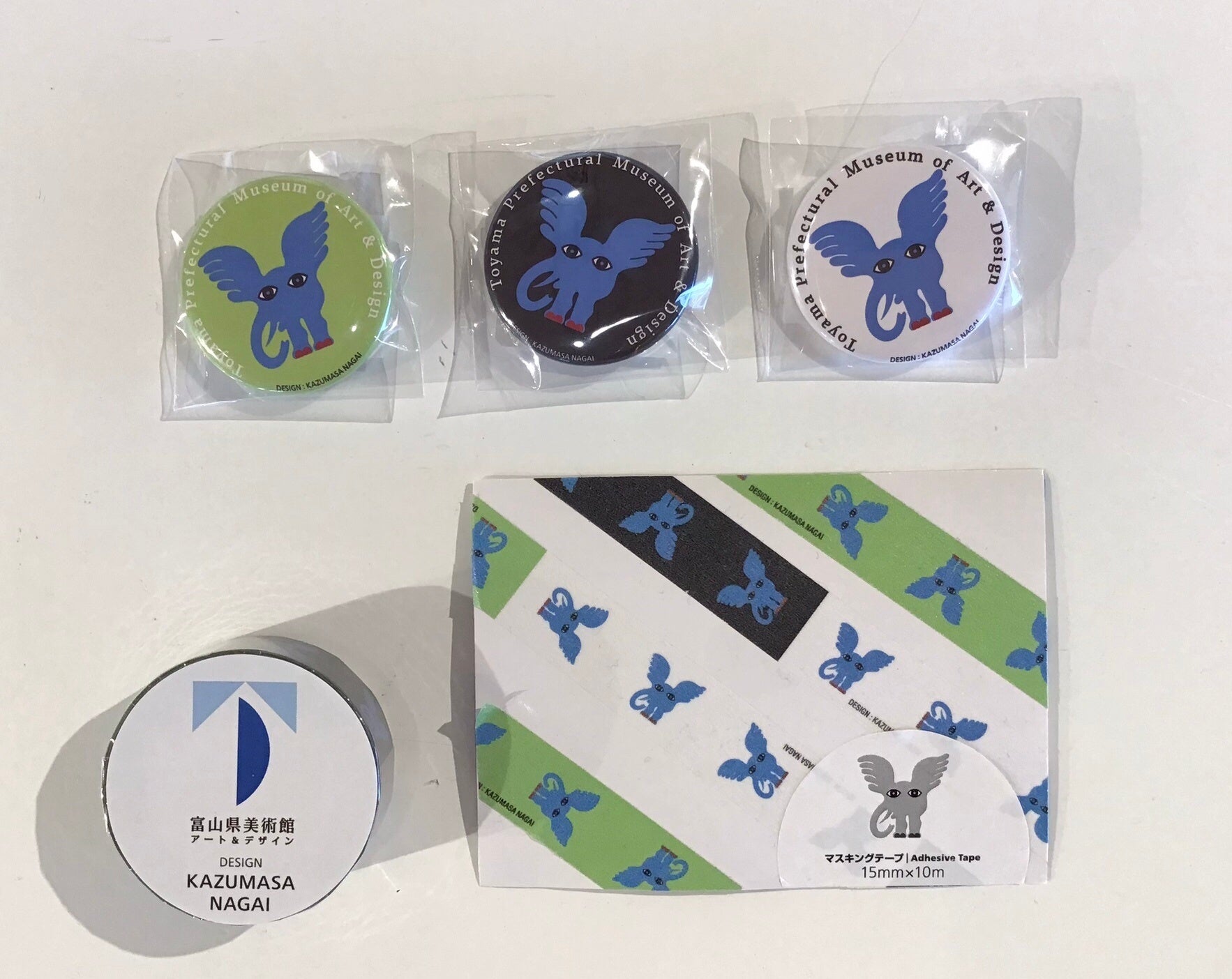 ミルゾー缶バッジ3種　各220円（税込）／ミルゾーマスキングテープ　385円（税込）／美術館オリジナルTADマーク440円（税込）